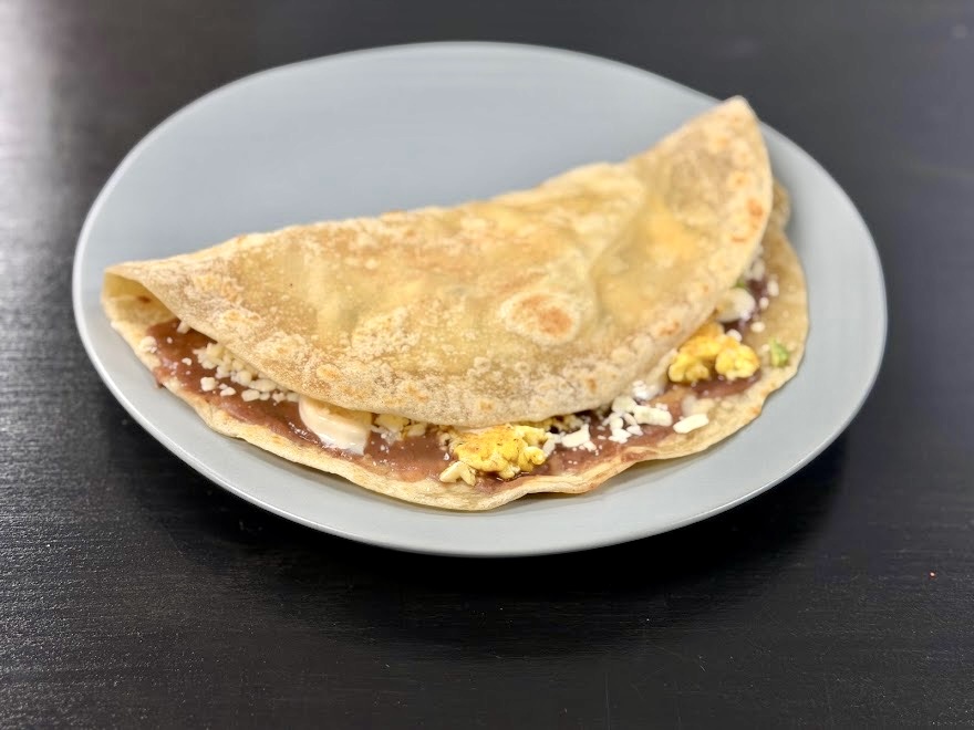 Quesadilla with beans, cheese and eggs on a plate