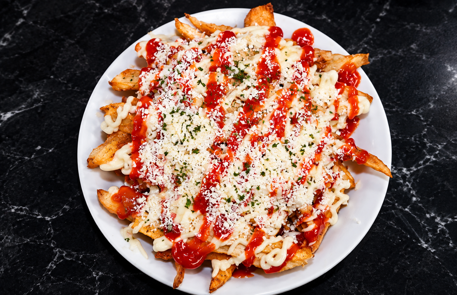 Loaded fries with cheese, crema and ketchup