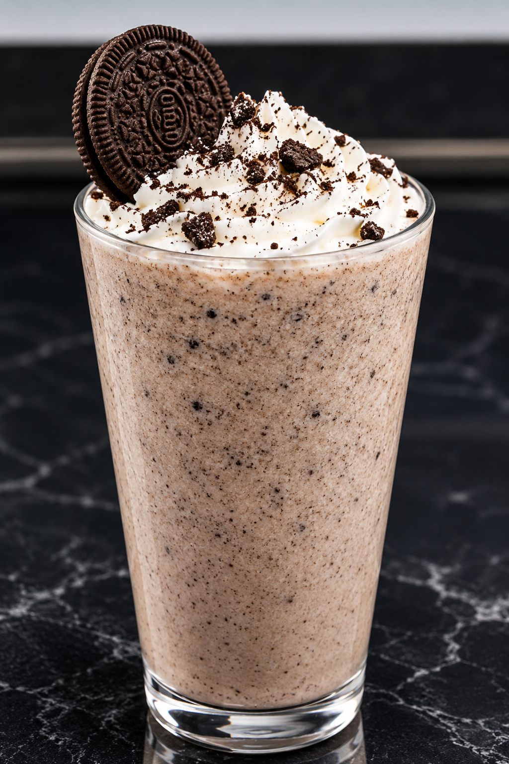 Cookies and cream milkshake topped with whipped cream